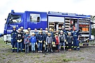 Gruppenfoto mit allen Teilnehmern vor dem Gerätekraftwagen I